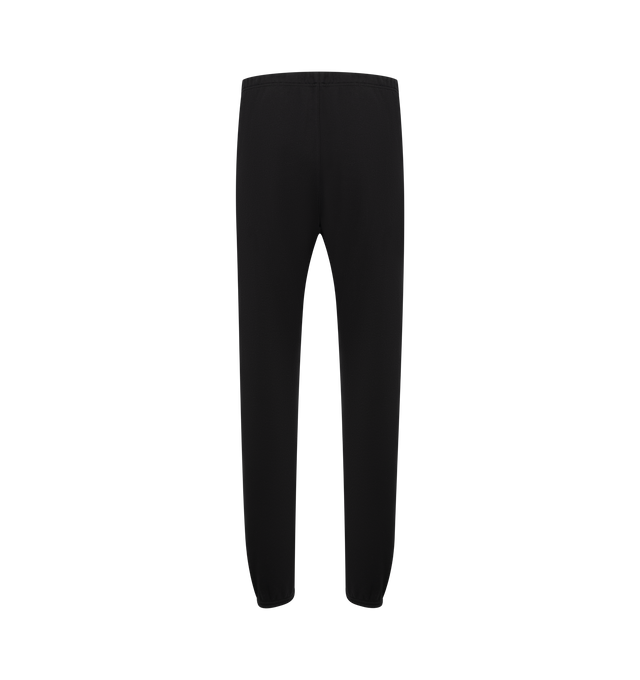 Image 2 of 3 - BLACK - FEAR OF GOD ESSENTIALS Vintage Fleece Sweatpant featuring vintage fit, slimmer leg, "Essentials Fear of God" beveled metallic logo, encased elastic waistband, heavyweight drawstring with rubberized tip, side seam pockets and "Fear of God Essentials" translucent rubberized label. 80% cotton, 20% polyester fleece.