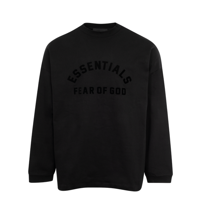 Image 1 of 2 - BLACK - FEAR OF GOD ESSENTIALS Crewneck Long Sleeve T-Shirt featuring rib knit crewneck and cuffs, logo bonded at front, dropped shoulders and rubberized logo patch at back. 100% cotton. Made in Viet Nam. 