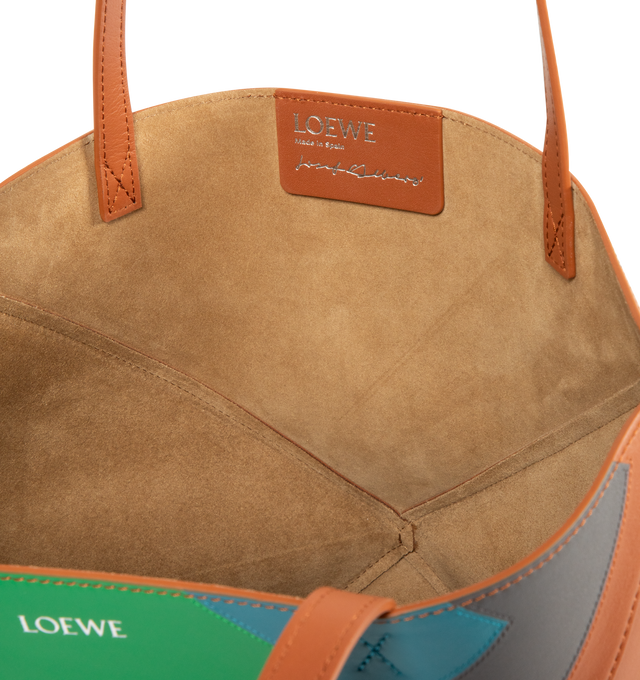 Image 3 of 3 - BROWN - Loewe Square Medium Puzzle Fold tote with a lightweight geometric structure designed to fold completely flat, making it a perfect tote to travel with. Shoulder or hand carry. Leather with suede lining and silver embossed LOEWE. Measures 31.5 cm high x 25.5 cm wide x 14.5 cm deep with 27cm handle drop.