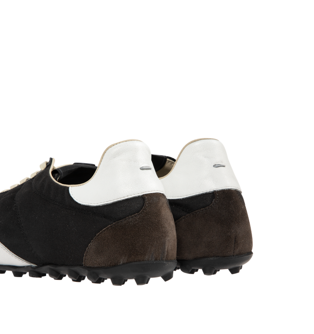 Image 3 of 5 - BLACK - MAISON MARGIELA Sprinters Low-Top Sneakers featuring drill cotton with vintage treatment, stripe down the center of the toe area, cleated rubber sole with numerical logo details, logo label on the tab, white stitching at the back and rubber sole. 54% polyester, 46% cotton. 100% calf leather. Made in Italy.