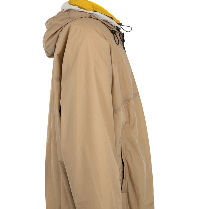Image 3 of 3 - NEUTRAL - Loewe Mens Technical Shell Anorak is crafted from lightweight technical shell with a triple-layer construction. Features a relaxed fit, regular length, zip-up neckline with hood, front welt pockets, elasticated hem with drawstring, and Double L embroidery at the chest. Main Material: Polyamide / Polyurethane. Made in Italy.