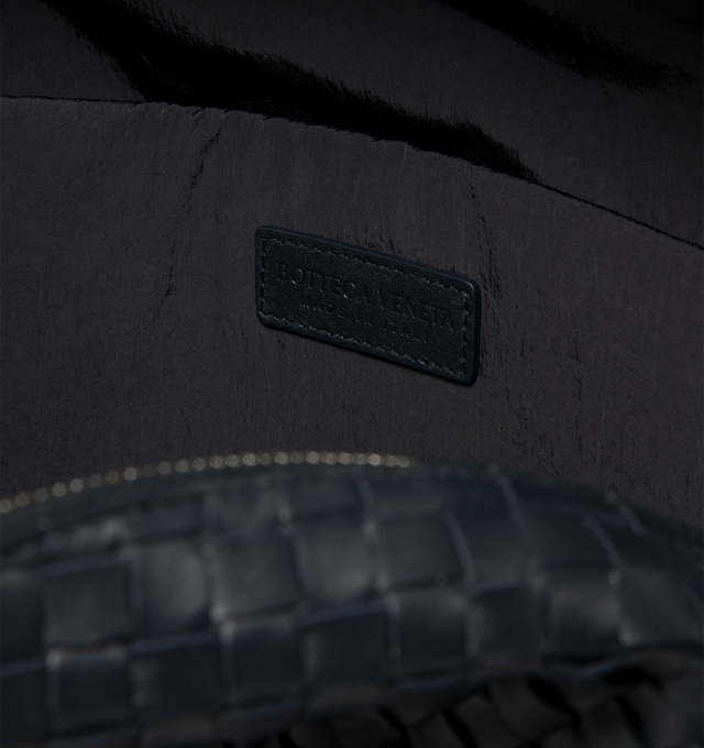 Image 3 of 3 - BLACK - Bottega Veneta Men's Backpack is crafted in silky calfskin leather. Featuring a backside in padded mesh with quilted Intreccio pattern, Single exterior front zipped pocket, Interior padded laptop compartment, Zipper closure, Lining: Nylon. Hardware: Silver finish. Made in: Italy