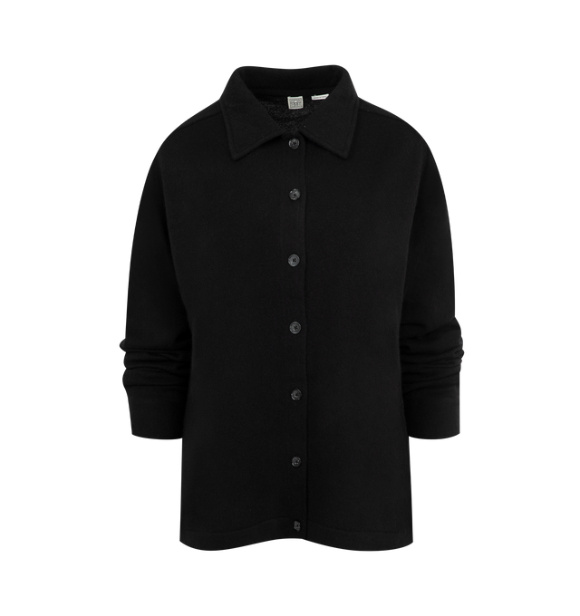 Image 1 of 2 - BLACK - Toteme Raglan Sleeve Cashmere Cardigan featuring a point collar and buttoned placket framed by a relaxed silhouette. 100% cashmere.