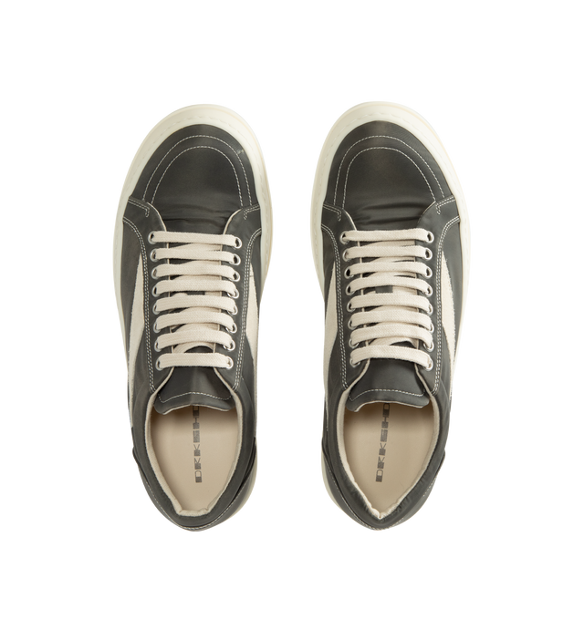Image 5 of 5 - GREY - Rick Owens DRKSHDW Vintage Sneaks are designed with a low-top design including a lace-up closure, signature shark-tooth soles, and contrast stitching. The medium-weight denim is overdyed for a soft, washed handfeel, while the fabric undergoes responsible treatment processes designed to reduce water consumption. Upper: 100% Cotton. Lateral Details: 100% Calf Leather. Lining: 100% Cotton. Sole: 100% Thermoplastic Rubber. Sole Height: 3.5 cm / 1.4 in. Closure: Lace-Up. Made in Italy.