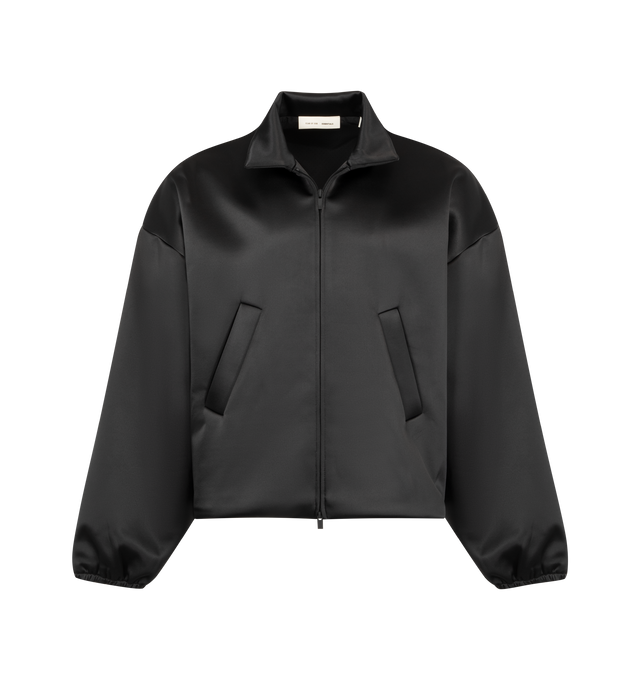 Image 1 of 2 - BLACK - FEAR OF GOD ESSENTIALS Bonded Satin Bomber made from a shiny, stretch fabric featuring a rounded, cropped bomber style with a mockneck, full front zip, slash pockets, elastic cuffs, and waist hem. A Fear of God Essentials rubberized label is stitched at the back collar. 94% polyester, 6% spandex.