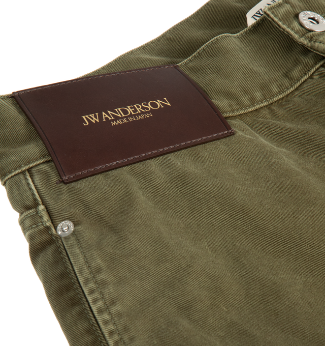 Image 2 of 2 - GREEN - JW ANDERSON Twisted Patch Pocket Shorts featuring twisted patch pocket shorts, utilitarian detailing and logo embossed leather patch. 100% cotton. Made in Japan.