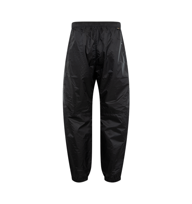 Image 2 of 3 - NAVY - STONE ISLAND Trousers featuring side zip pockets, two back pockets, Stone Island Ghost badge on left leg pocket, elasticated cuffs, elasticated waistband with internal drawstring and loose fit. 100% polyamide/nylon.