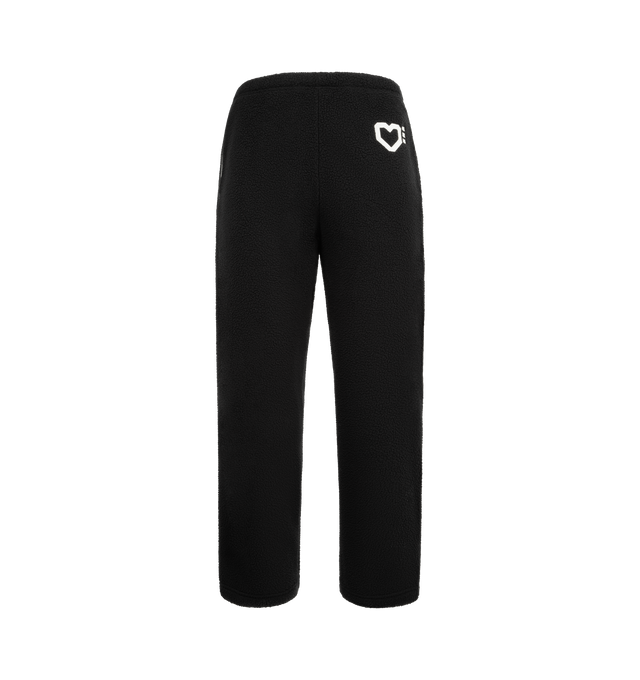 Image 1 of 4 - BLACK - HUMAN MADE Fleece Pants featuring a tapered silhouette, soft and comfortable polyester boa fleece, heart motif applique on the front, brand logo embroidered on the back pocket, line tape down the sides and side fasteners on the cuffs. 100% polyester.