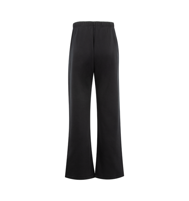 Image 2 of 3 - BLACK - FEAR OF GOD ESSENTIALS Training Classic Flare Sweatpant featuring 390GSM core fleece, relaxed silhouette extends into a flared leg, encased elastic waistband with elongated drawcords, side seam pockets, puff-printed Essentials training logo on the leg and an Essentials signature label at the center front. 80% cotton, 20% polyester.