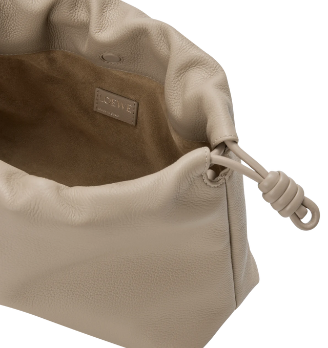 Image 4 of 4 - NEUTRAL - LOEWE Medium Flamenco Purse in fine grained calfskin featuring a ruched shape, historical knot drawstrings, shoulder, crossbody or hand carry, detachable donut chain with Anagram Pebble, detachable and adjustable leather strap, magnetic closure, suede lining and silver embossed LOEWE. Fine grained calf. 20 cm x 30 cm x 10.5 cm. Made in Spain.