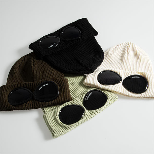 Knit beanies in off white, pale green, dark brown and black with signature C.P. Company goggle details