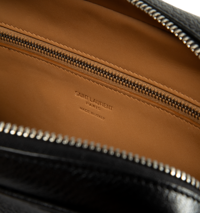 Image 3 of 3 - BLACK - Saint Laurent Men's Small Leather Camera Bag is crafted from grained leather and features a compact camera bag silhouette accented by the maison's signature lettered logo. Designed for everyday versatility, this style is finished with a removable and adjustable shoulder strap, a top zip closure, silver-tone hardware, and multiple pockets for organized storage. Main Material: Grained Leather. Hardware: Silver-Tone. Closure: Top Zip. Strap: Removable and Adjustable Shoulder Strap. Exter