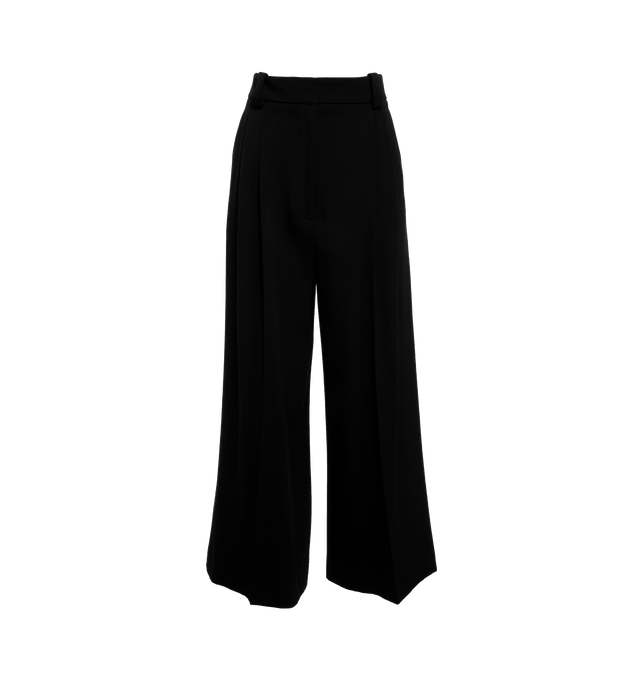 Image 1 of 4 - BLACK - KHAITE Simone Pant featuring mid-rise, reverse pleats, relaxed leg, wider waistband, inset side pockets, and welt pockets. 77% virgin wool, 23% viscose. 