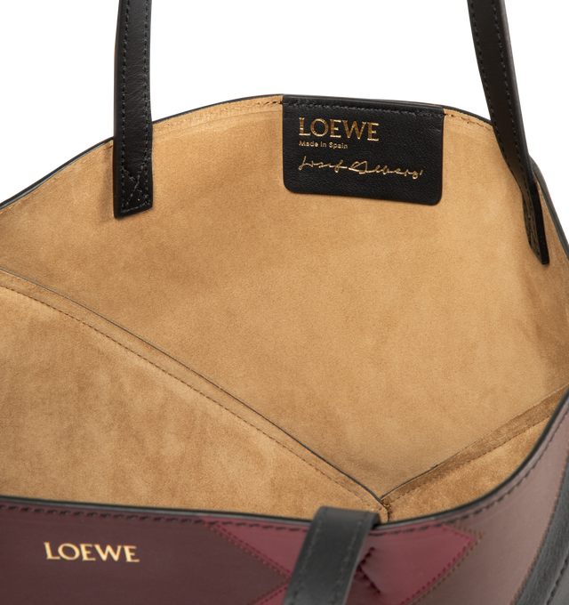 Image 3 of 3 - BLACK - Loewe Square Medium Puzzle Fold tote with a lightweight geometric structure designed to fold completely flat, making it a perfect tote to travel with. Shoulder or hand carry. Leather with suede lining and silver embossed LOEWE. Measures 31.5 cm high x 25.5 cm wide x 14.5 cm deep with 27cm handle drop.