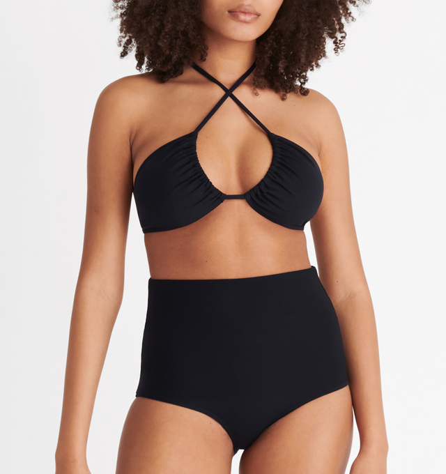Image 5 of 8 - BLACK - ERES Energy Small Triangle Bikini Top featuring small triangle bikini top, multi-position and adjustable and sliding spaghetti straps (halter tie straight or crossed in the front) with branded tips. 84% Polyamid, 16% Spandex. Made in Morocco.  