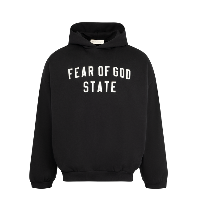Image 1 of 3 - BLACK - FEAR OF GOD ESSENTIALS 90s Fit Fleece Hoodie featuring cotton-blend fleece hoodie, rubber logo patch at hood, logo appliqus at front, seam pockets at waist, rib-knit hem and cuffs and dropped shoulders. 80% cotton, 20% polyester.