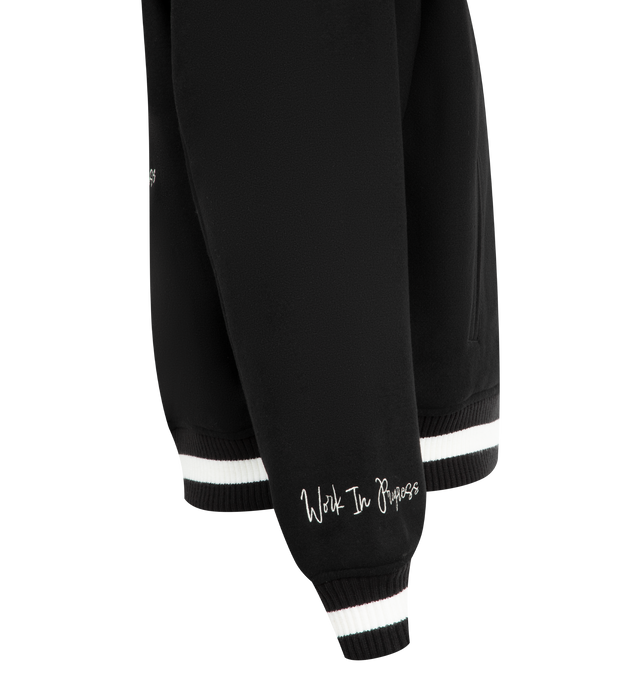 Image 4 of 4 - BLACK - CARHARTT World Class Varsity Jacket featuring nylon diamond quilted lined, rib-knit cuffs and bottom band, two front piped pockets, graphic embroidery and patches, inside chest pocket and front closure with personalized snaps. 70% polyester, 30% wool.