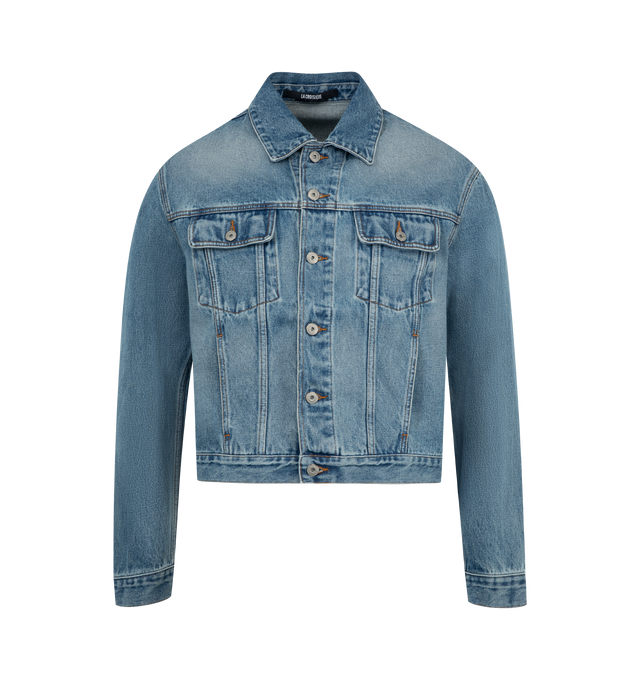 Image 1 of 3 - BLUE - JACQUEMUS Denim Jacket featuring straight cut, washed indigo denim, pointed collar, engraved metal buttons, denim patch pockets, buttoned cuffs, front and back yoke, buttoned tab on the back hem, silver hardware, large denim patch and contrast stitching. 100% cotton. Made in Portugal.