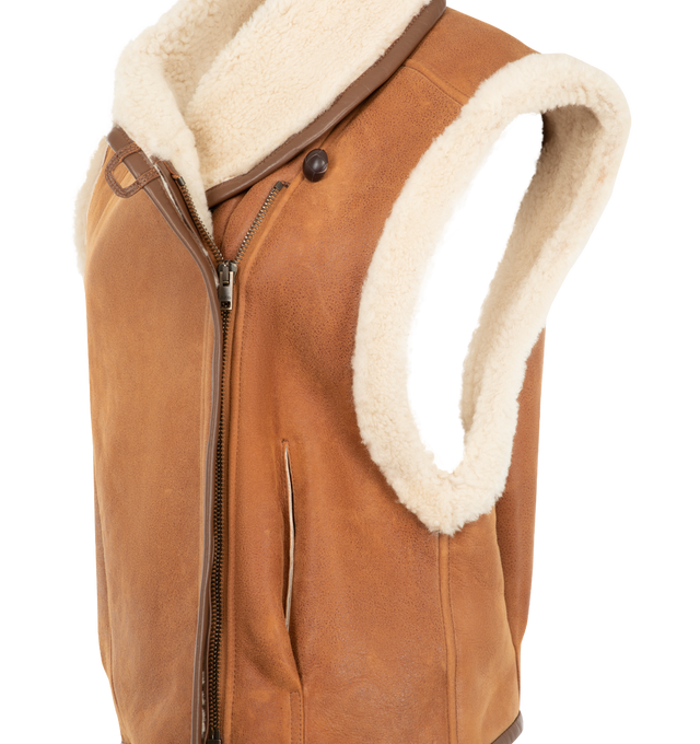 Image 3 of 3 - BROWN - Isabel Marant Womens Shearling Vest is crafted from genuine lamb fur and lamb leather. Features a stand collar, asymmetric button-front closure, sleeveless silhouette, contrast leather trim, and a cropped fit. Main Material: 100% Lamb Fur & Lamb Leather. Made in Turkey.