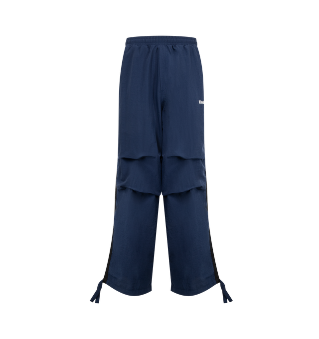 Image 1 of 2 - BLUE - RHUDE Track Pants featuring concealed drawstring at elasticized waistband, four-pocket styling, logo printed at front, tucks at knees and drawstring at elasticized cuffs. Made in United States.