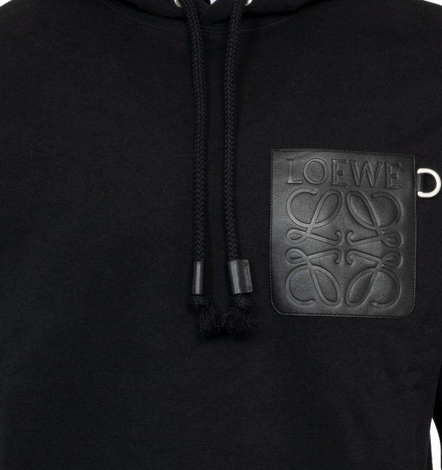 Image 3 of 3 - BLACK - LOEWE Relaxed Fit Hoodie featuring relaxed fit, regular length, LOEWE Anagram embossed leather patch pocket at the chest, hooded collar, drawstring with LOEWE embossed tab and ribbed cuffs and hem. 100% cotton.  