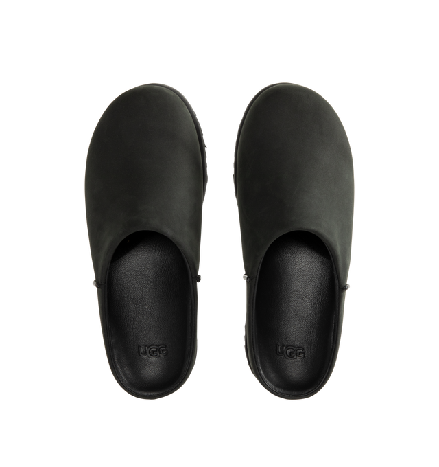 Image 4 of 4 - BLACK - UGG Men's Otzo Clog built with a luxe nubuck upper, thoughtful knit + leather lining, and a contoured footbed for steady movement. This clog has easy slip-on style with all-day comfort. Waterproof leather, nubuck upper, leather and wool jersey lining with peppermint-based anti-odor treatment. Contoured EVA footbed, lightweight rubber outsolewith embossed UGG logo.