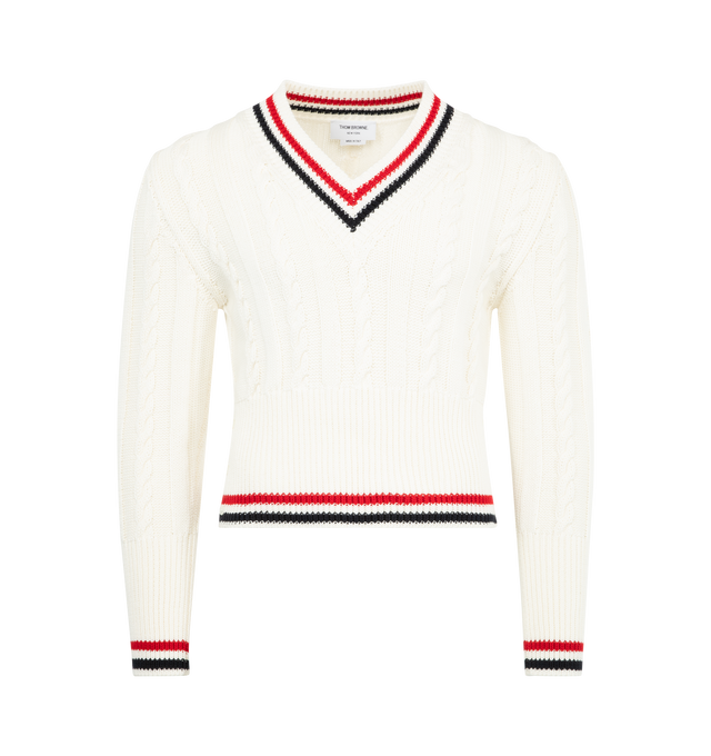 Image 1 of 2 - WHITE - THOM BROWNE Baby Cable V Neck Pullover featuring knitted construction, cable knit, striped border, plunging V-neck, side button fastening, long sleeves, buttoned cuffs, ribbed cuffs and hem and straight hem. Cotton.