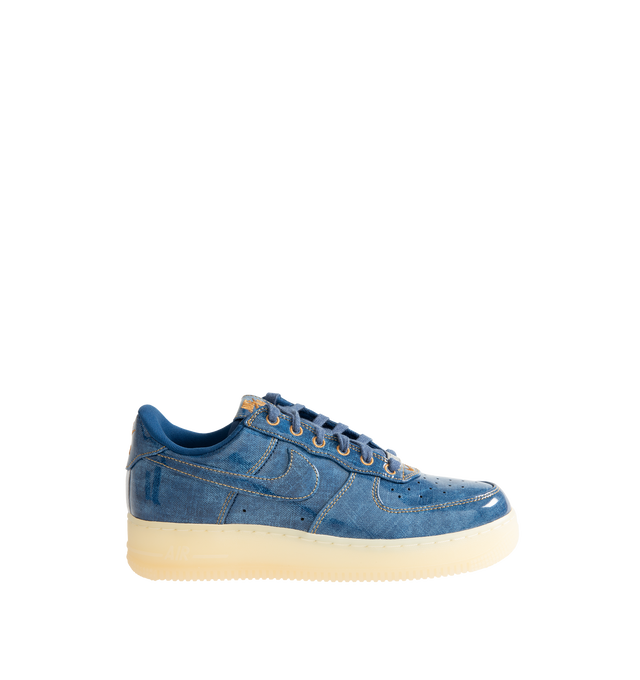 Image 1 of 5 - BLUE - Nike Men's Air Force 1 Low Retro Premium Sneaker featuring patent leather denim upper with perforated toe box, Nike Air technology and rubber outsole with heritage hoops pivot circles.