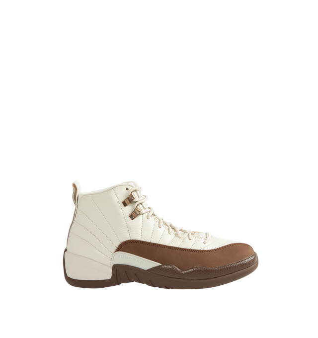 Image 1 of 5 - BROWN - Air Jordan 12 Retro "Fireside" Men's Shoes feature the iconic AJ12 silhouette in a seasonal colorway inspired by cozy autumn evenings. Crafted with a premium leather upper, this heritage basketball style combines Light Orewood Brown and Cacao Wow tones with the signature radial stitch detailing that pays homage to the original design worn by Michael Jordan. Full-length Air Zoom cushioning delivers responsive comfort, while a durable rubber outsole provides reliable traction for ever