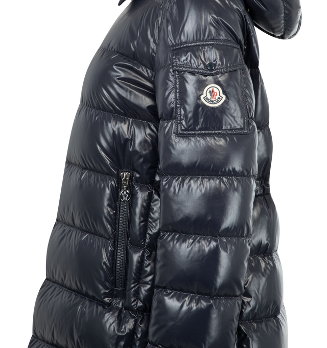 Image 3 of 3 - BLUE - MONCLER Courcelles Hooded Mid-Length Down Jacket featuring nylon laqu lining, down-filled, hood, zipper closure, zipped pockets, sleeve pocket with snap button closure, waist and hem with drawstring-fastening and adjustable cuffs. 100% polyamide/nylon. Padding: 90% down, 10% feather.
