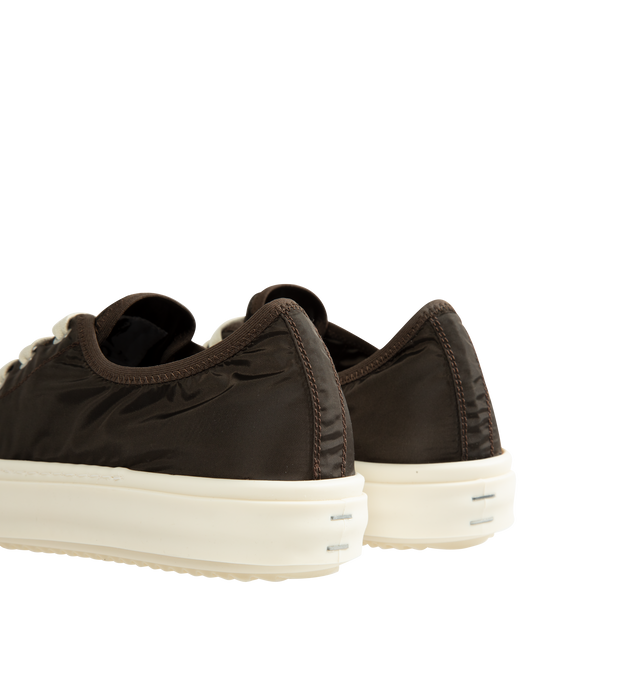 Image 3 of 5 - BROWN - Rick Owens Men's Tower Low Sneakers are crafted from a nylon and polyester blend and feature an extra-low silhouette that rises at the back, four-eyelet lace-up closure, six side vents, toe caps, and signature shark-tooth bumper soles. Main Material: 67% Nylon, 33% Polyester. Toe: 100% Calf Leather. Lining: 67% Nylon, 33% Polyester. Insole: 100% Calf Leather. Sole: 100% Thermoplastic Rubber. Closure: Lace-Up. Made in Italy.