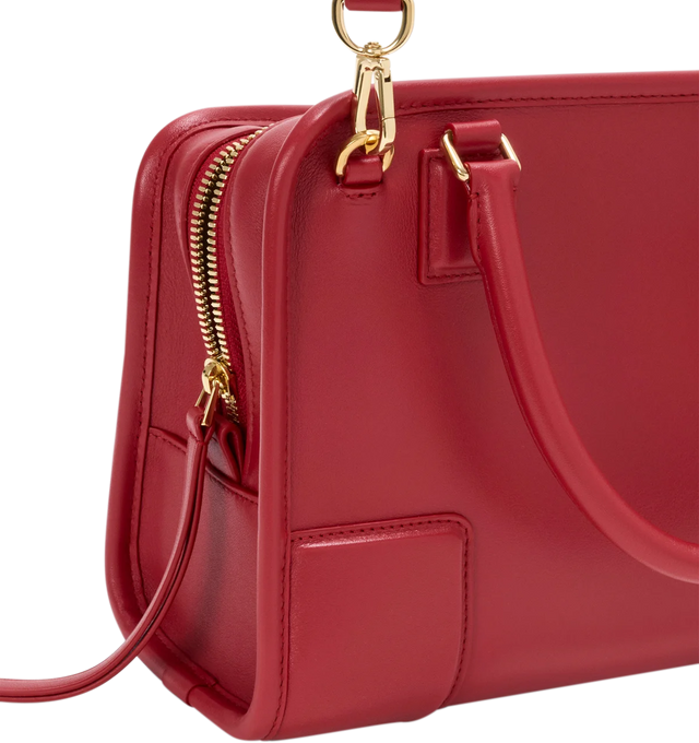 Image 15 of 18 - RED - Loewe Small Amazona 180 Bag in leather features a relaxed silhouette anchored by a single toron top handle, designed to be carried open, while a concealed closure secures the main compartment, three carry options: short handle, removable shoulder strap and crossbody, zip closure with two leather zip pullers, two compartments, main compartment closed with magnetic closure, internal flat pocket, left side d-ring for customization, nappa lambskin lining, and embossed double L branding. L
