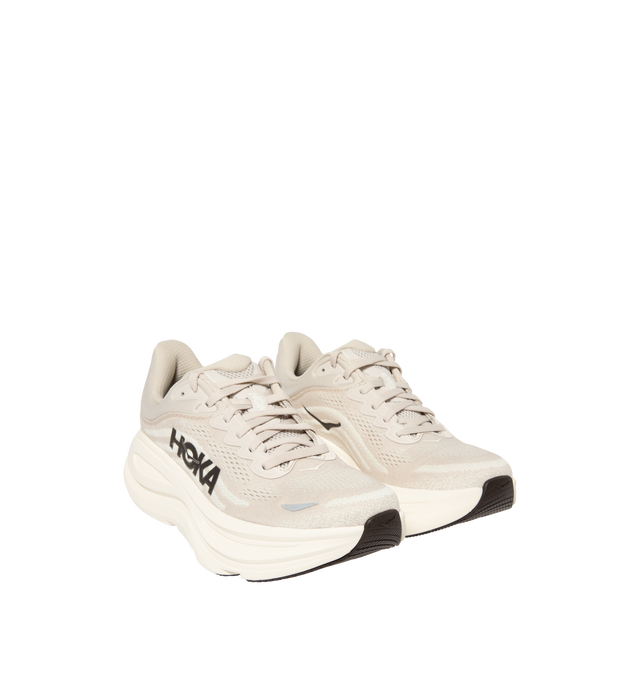 Image 2 of 5 - NEUTRAL - Hoka M Bondi 9 Sneaker featuring engineered mesh upper with rubber sole, lace-up front, foamed EVA midsole and increased stack height for maximum cushioning, zonal breathability, reflective detailing and cushioned tongue and collar.