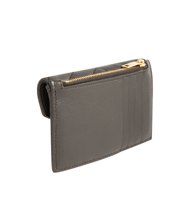 Image 2 of 3 - GREEN - SAINT LAURENT Zip Card Case with flap in soft nappa leather, decorated with the CASSANDRE and chevron-quilted topstitching, leather lining, gold-toned hardware, snap-button closure, one zip coin pocket and five card slots. 5.1" x 3.1" x 0.7". Calfskin leather. Made in Italy.
