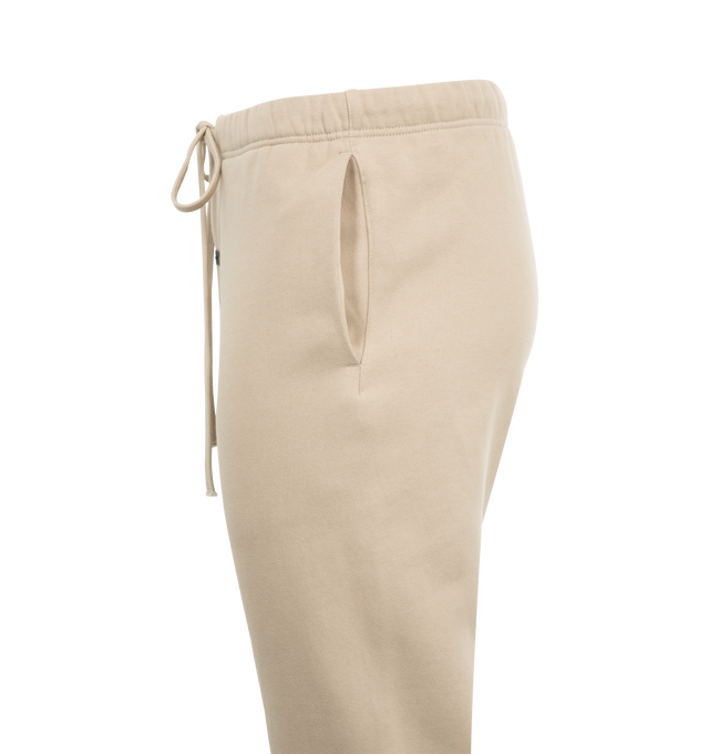 Image 3 of 3 - BROWN - FEAR OF GOD Vintage Sweatpant featuring an encased elastic waistband and bottom hem, elongated drawstrings, side seam pockets and front center translucent rubberized label. 80% cotton, 20% polyester fleece.