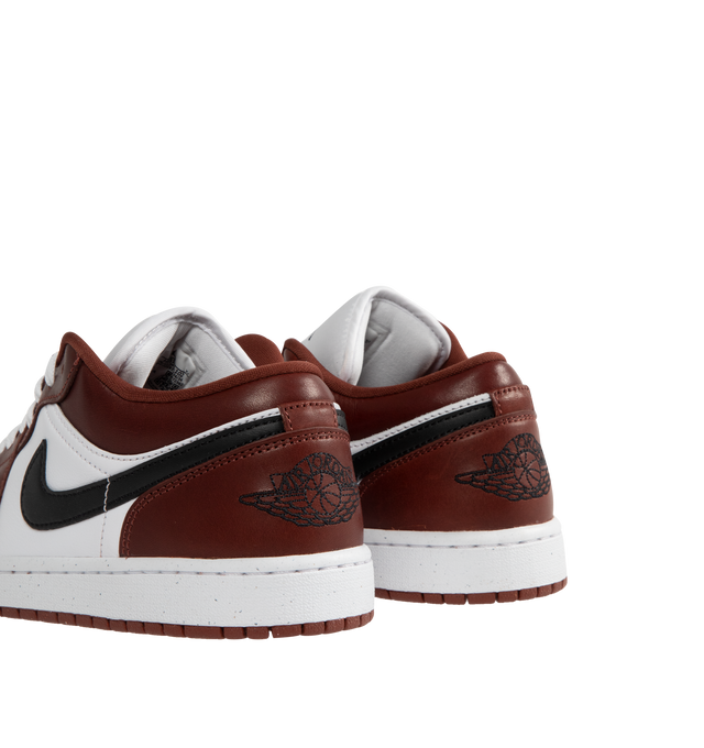 Image 3 of 5 - RED - JORDAN Air Jordan 1 Low SE Sneaker featuring real and synthetic leather in the upper, Nike Air technology, foam midsole, rubber in the outsole, wings logo on heel and jumpman on tongue.
