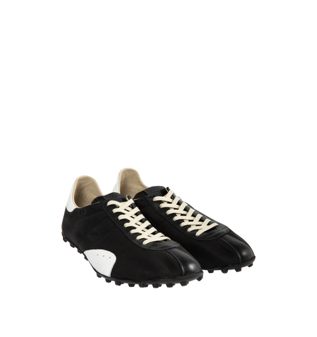 Image 2 of 5 - BLACK - MAISON MARGIELA Sprinters Low-Top Sneakers featuring drill cotton with vintage treatment, stripe down the center of the toe area, cleated rubber sole with numerical logo details, logo label on the tab, white stitching at the back and rubber sole. 54% polyester, 46% cotton. 100% calf leather. Made in Italy.