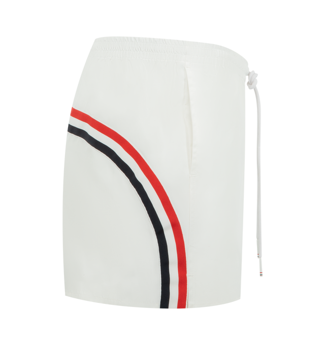 Image 3 of 3 - WHITE - THOM BROWNE Nylon Tech Track Short featuring elasticated drawstring waistband with RWB-detailed aglets, slip hand pockets, curved RWB grosgrain trim across back and signature striped grosgrain loop tab. 51% polyamide, 49% cotton. Lining: 65% polyester, 35% cotton. Made in Italy.