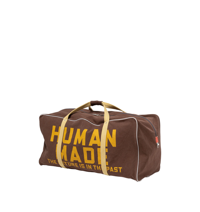 Image 3 of 8 - BROWN - HUMAN MADE Canvas Boston Bag Large featuring thick, tough cotton canvas, bio-washed for a vintage-like feel, graphics appear on both sides, external pocket and an internal zip pocket, heart-shaped rivets and 100L capacity. 100% cotton.