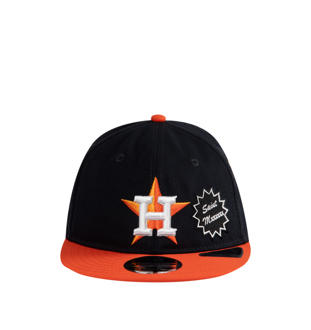 Image 1 of 2 - NAVY - SAINT MICHAEL Astros Cap featuring embroidered Astros logo on front, patches throughout, flat brim and adjustable back strap.