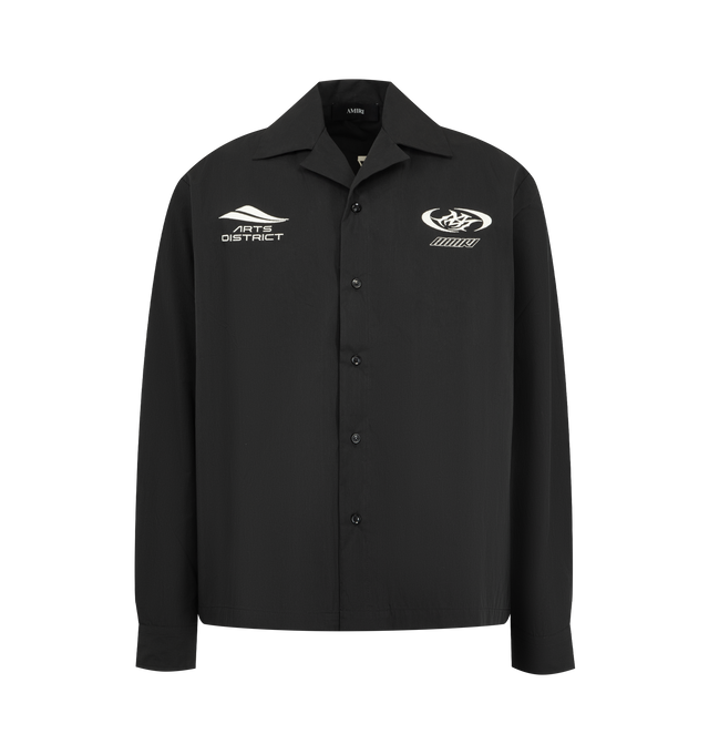 Image 1 of 2 - BLACK - AMIRI Sport Emb Cotnyl Camp Shirt featuring button front closure, graphics printed on chest and back, button cuffs and notched collar. Made in Italy.