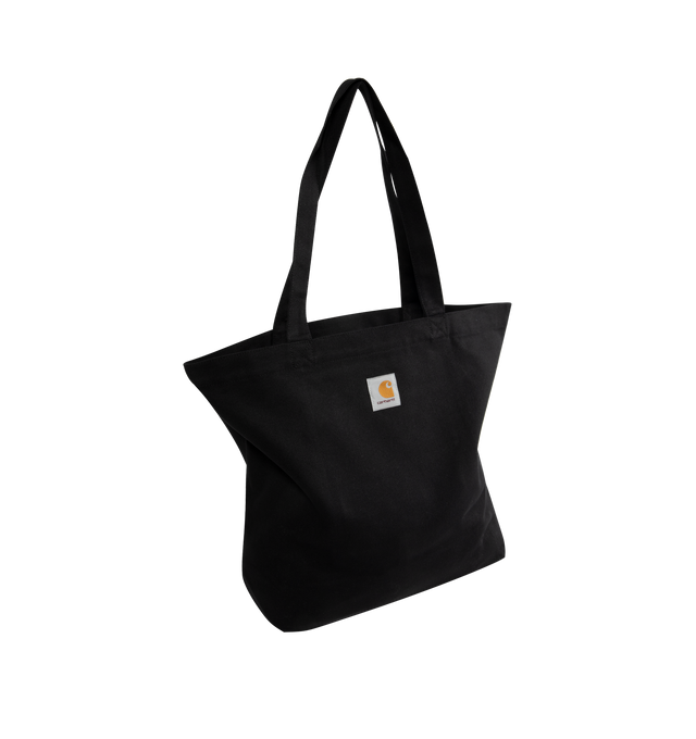 Image 2 of 3 - BLACK - CARHARTT WIP Canvas Graphic Tote featuring dearborn canvas 11.4 oz, allover graphic print, unlined with reinforced seams, swinging inner pocket and square Label. 7 x 46 x 14 cm; 15 L capacity.