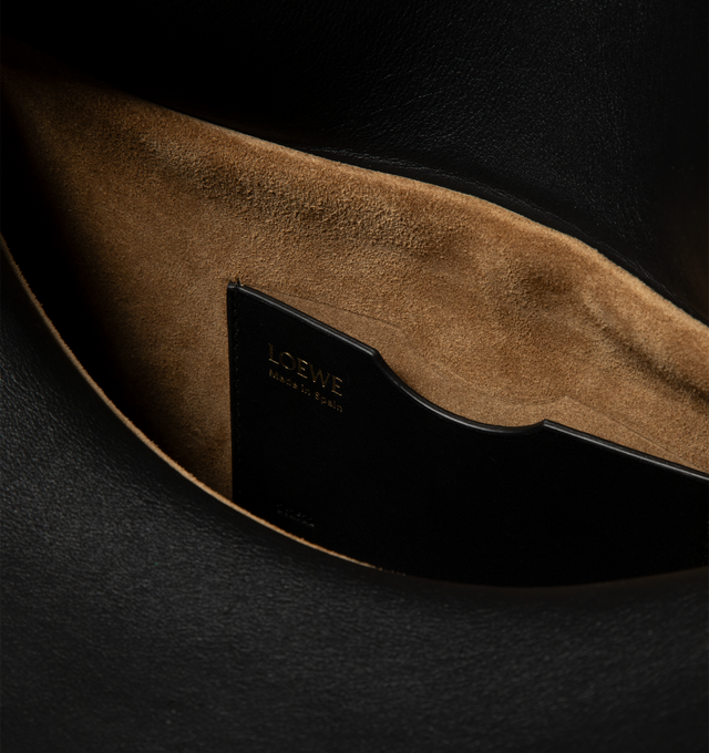 Image 4 of 4 - BLACK - LOEWE Medium Ola bag in smooth calfskin featuring a curved body, a flowing flap closure, a statement detachable donut chain, detachable tubular calfskin strap, one internal pocket, gold embossed LOEWE and engraved Anagram. Smooth Calf. 18 cm x 26 cm x 13 cm. Made in Spain.