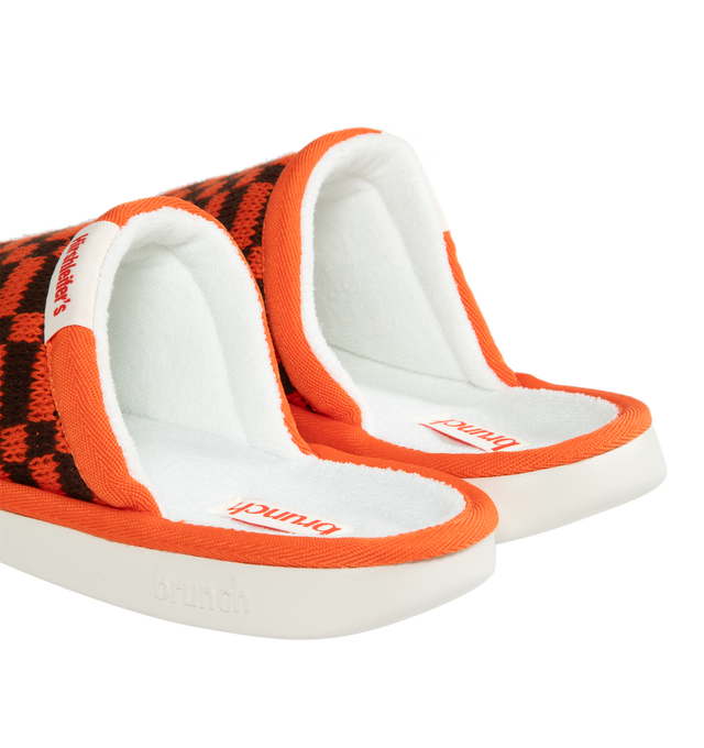 Image 3 of 4 - ORANGE - BRUNCH L'Essentiel Slippers are a slip on style with soft terry upper and padded insole. Upper: 51% cotton, 42% recycled polyester, 7% polyamide. Footbed: 100% recycled polyester. Outsole: 20% recycled EVA, 80% EVA.Maintaining the iconic hotel-slipper aesthetic, this knit L'Essentiel is designed to be more comfortable than ever. The footbed features EVA foam that molds to the foot while offering a countered shape that protects and cradles the heel. Meanwhile, the outsole is made from 