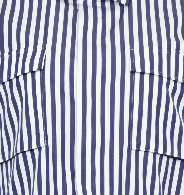 Image 3 of 3 - NAVY - SACAI Thomas Mason Cotton Poplin Shirt featuring button down shirt, boxy silhouette, patch pockets, spread collar and drawstring hemline. 100% cotton. 