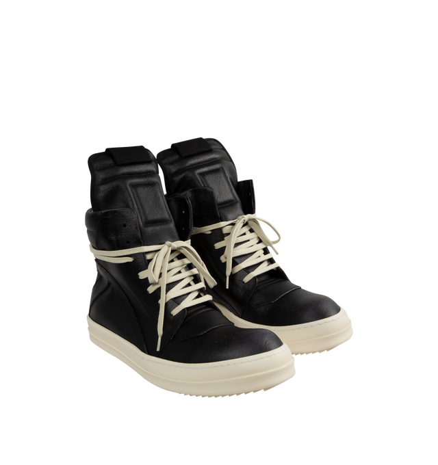 Image 2 of 5 - BLACK - Rick Owens Geobasket Sneakers featuring high-top, LWG-certified grained calfskin, perforated detailing at toe, lace-up closure, pull-loop at extended padded tongue, quilted padded collar, zip closure at inner side, buffed calfskin lining and treaded rubber sole. Upper: calfskin. Sole: rubber. Made in Italy.