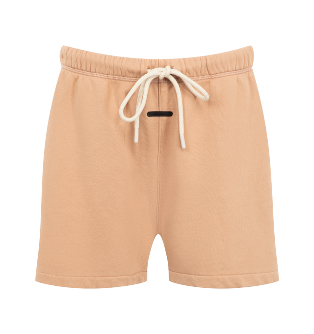 Image 1 of 3 - ORANGE - Fear of God Essentials Womens Classic Sweatshorts are crafted from heavyweight cotton fleece with a pigment-dyed finish. Feature a relaxed classic fit, elasticized waistband with adjustable drawcord and bungee, side-seam pockets, and signature Essentials label. Main Material: 100% Cotton. Imported.