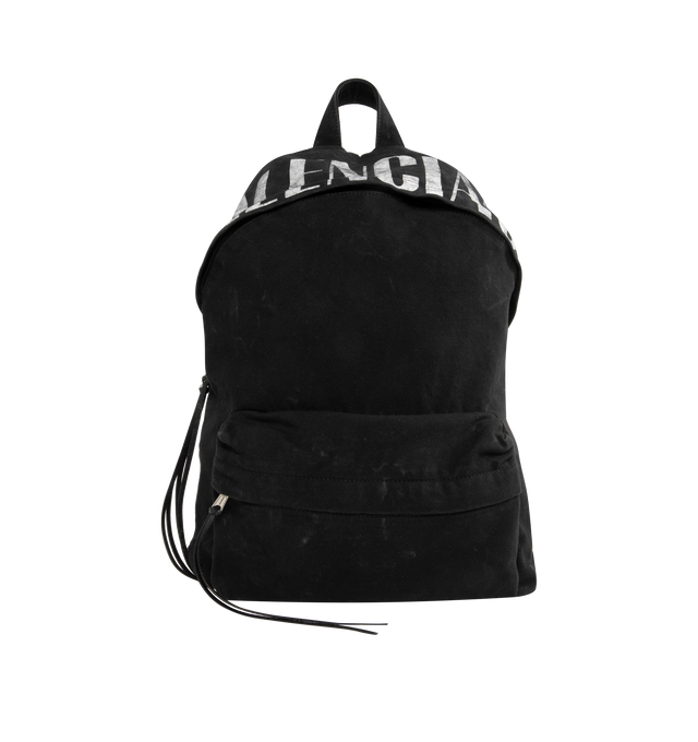 Image 1 of 3 - BLACK - BALENCIAGA Editor Backpack featuring one top handle, adjustable shoulder straps, Balenciaga logo printed at front. aged-silver hardware, front zipped pocket, zipped closure with with knotted puller, 1 main compartment, 1 inner flat pocket and Balenciaga logo engraved zipper puller. Cotton canvas lining. L13.3 x H18.1 x W6.3 inch. Cotton, lambskin, polyester. Made in Italy.