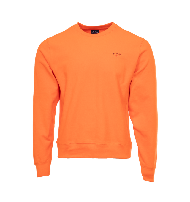 Image 1 of 3 - ORANGE - NOAH Core Logo Pocket T-shirt featuring embroidered logo on chest, crew neck, long sleeves and ribbed cuffs, hem and collar. 100% cotton.  