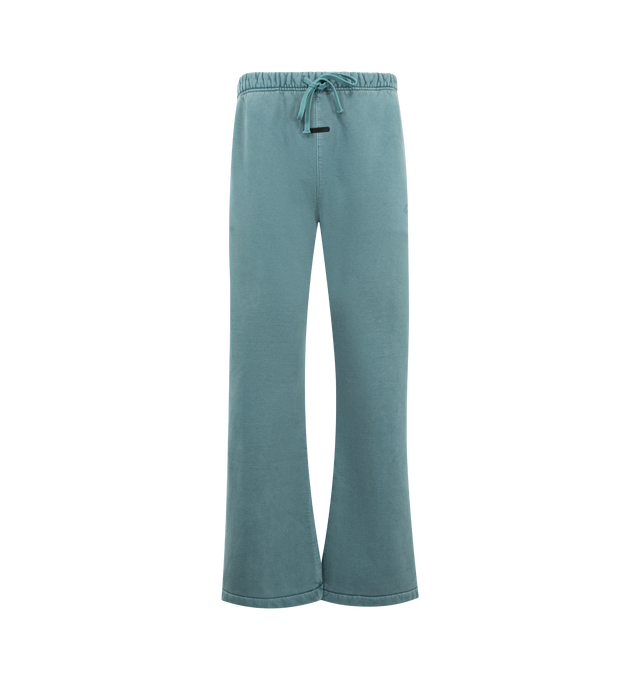 Image 1 of 3 - BLUE - FEAR OF GOD ESSENTIALS Signature Classic Flare Sweatpant featuring 520GSM heavyweight fleece, pigment-dyed, relaxed silhouette, flared leg, an encased elastic waistband with elongated drawcords, side-seam pockets, Essentials signature logo embroidered on the leg and an Essentials signature label at the center front. 100% cotton.